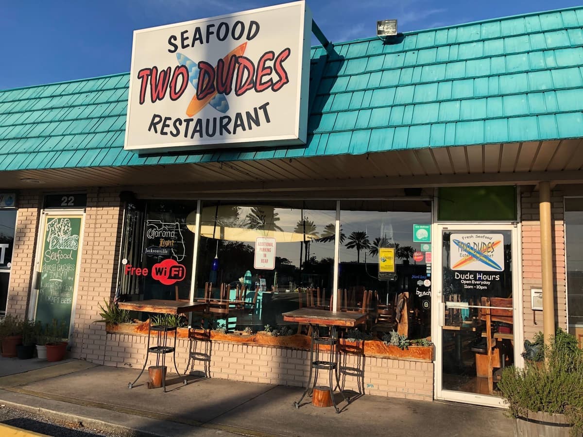 Two Dudes Seafood storefront at golden hour on Sailfish Drive